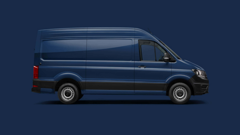 A VW Crafter Panel Van against a plain blue background. 