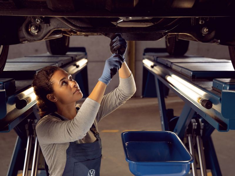 A mechanic fixing a car