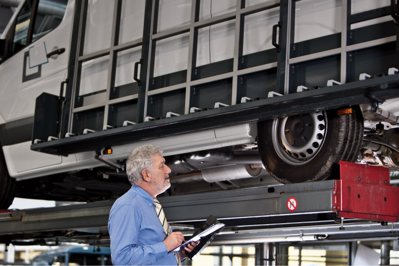 Technician inspecting a VW van in Van Centre