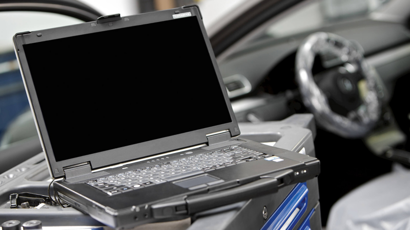 laptop and tools in VW van centre