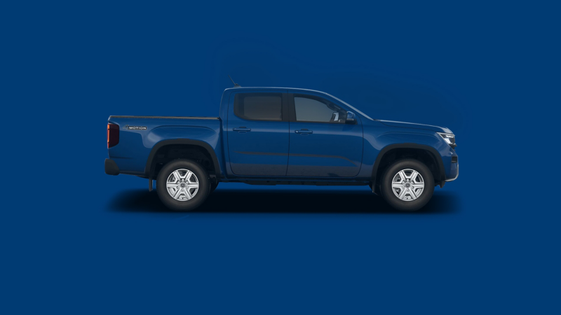 A VW Amarok against a plain blue background. 