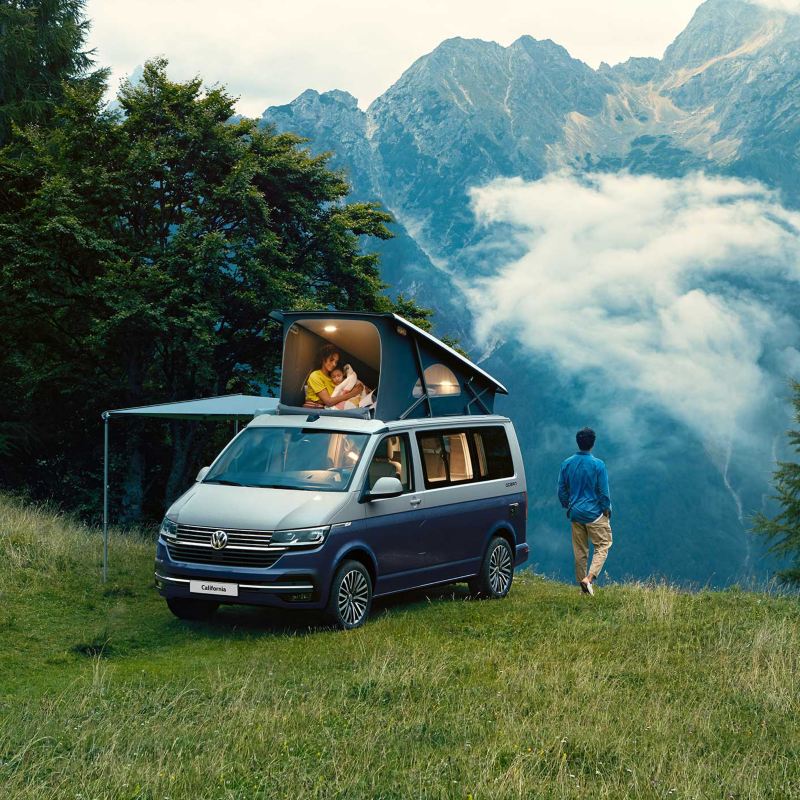 VW California camper vans with pop-up roof by coast