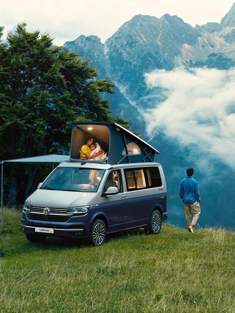 VW California camper vans with pop-up roof by coast