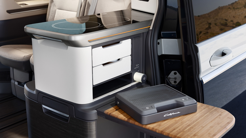 Portable grill plate in the VW California.