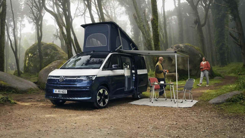 Photo of a parked California by a lake. 