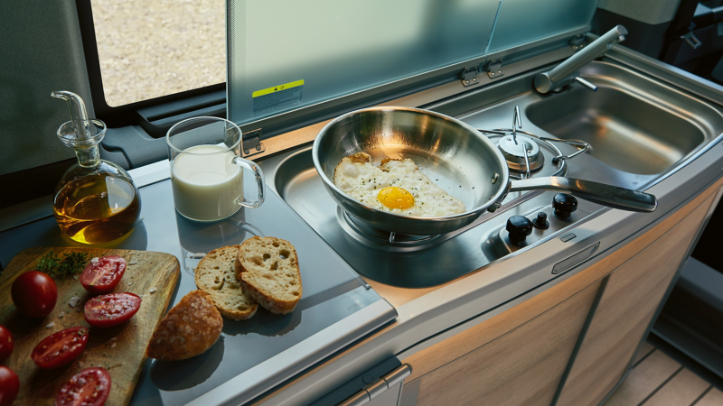 Preparing a fried egg in the California kitchen.