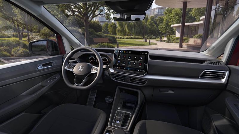 Interior of the Caddy showing the steering wheel and infotainment system