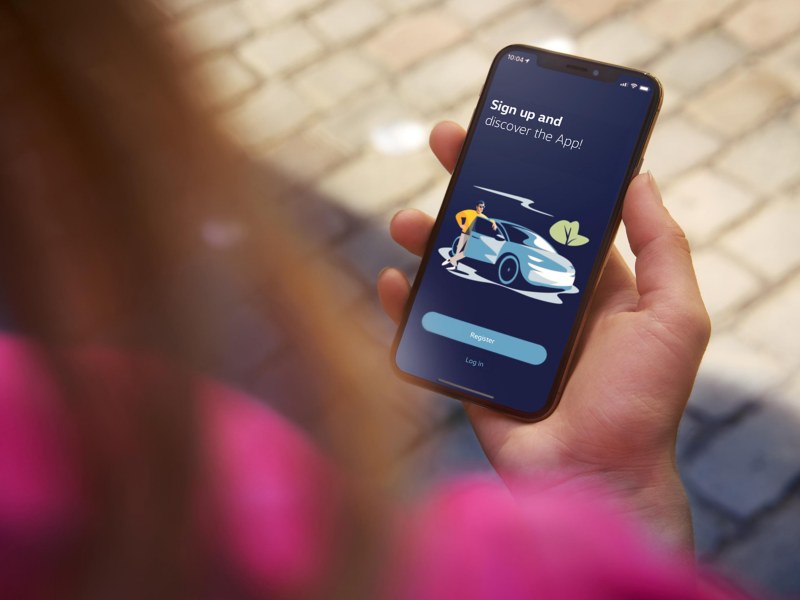 A woman holding a smartphone in her hand.