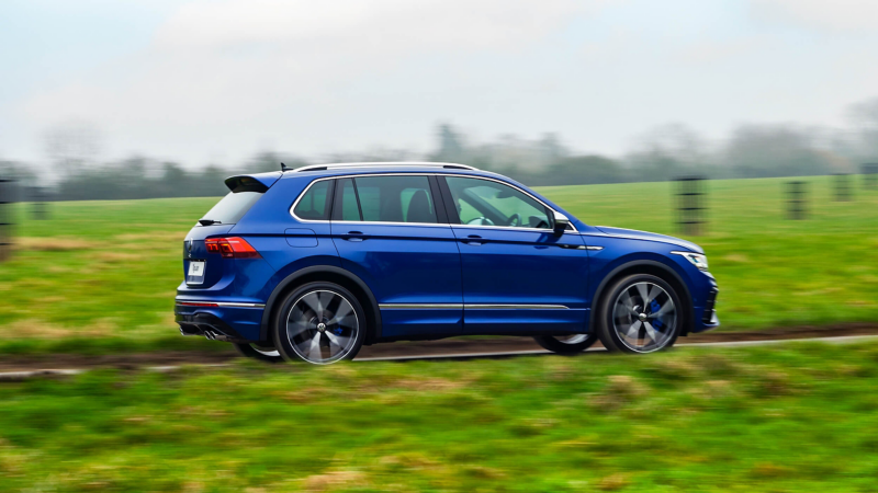 A blue Tiguan R driving along a road