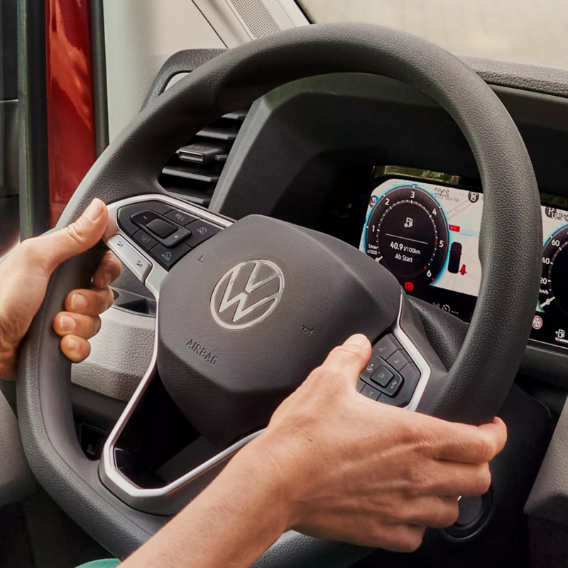 Interior photo of the cockpit area showing the multifunction steering wheel. 