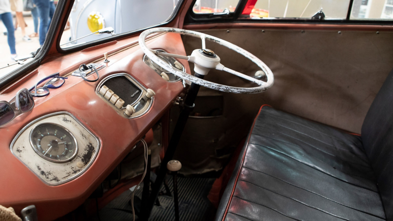 Photo showing the interior cockpit of a VW Samba van.
