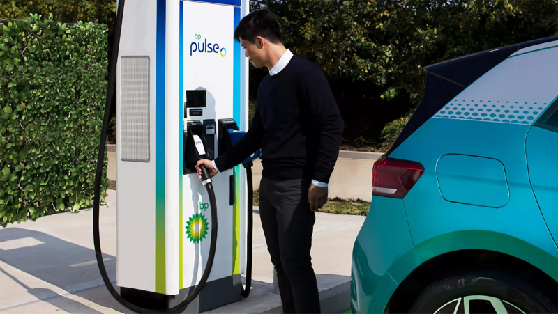 Electric bp partnership man at charging station