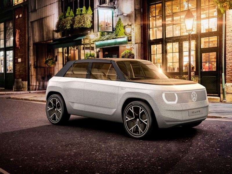A VW ID. LIFE concept car parked on a street a night