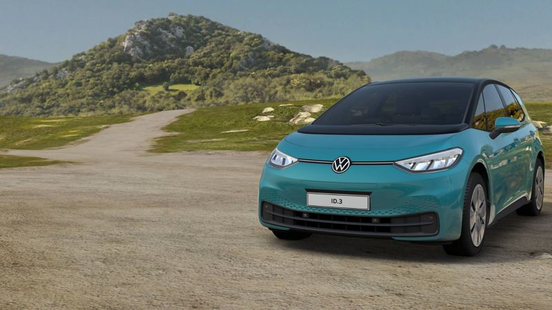 A blue ID.3 parked against a countryside background. 