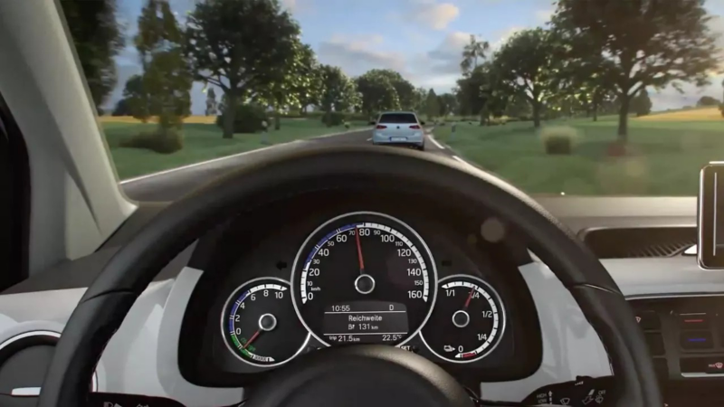 CGI interior shot of VW Up driving behind a VW Golf