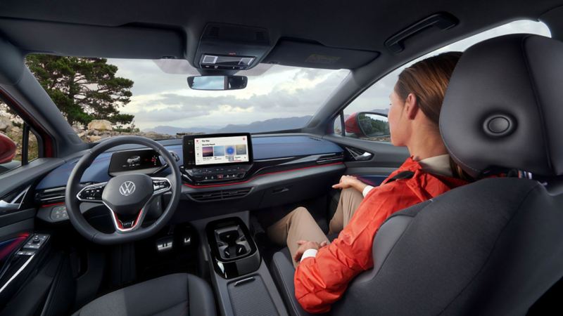 Volkswagen ID.4 connectivity, a woman sitting and watching screen