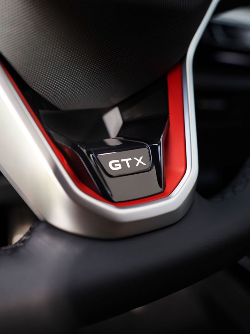 GTX Logo on the steering wheel of a red VW ID.5 GTX.