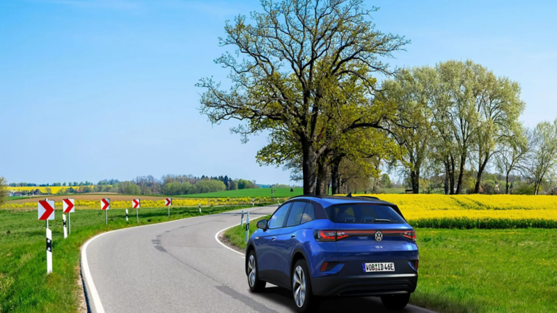 Blue ID.4 on a country road in the day time