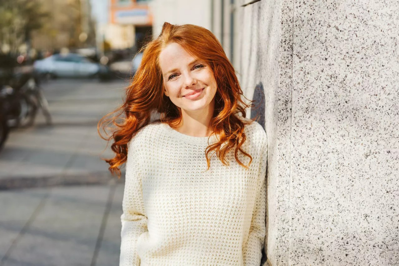 Woman standing and smiling