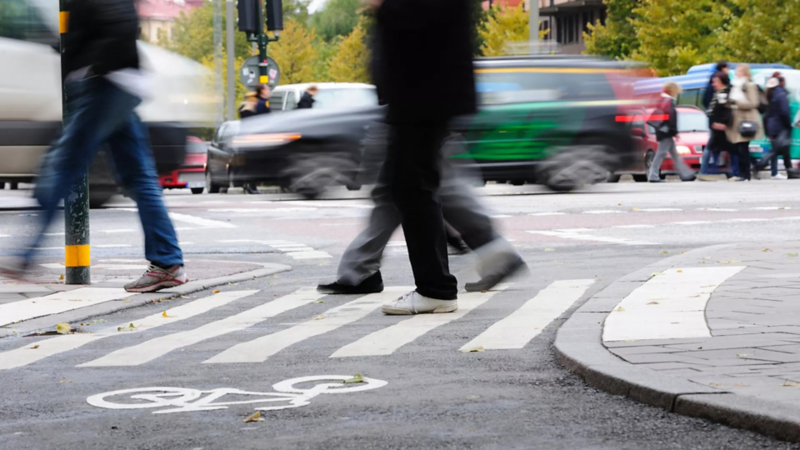 Pedestrian walk with commuters