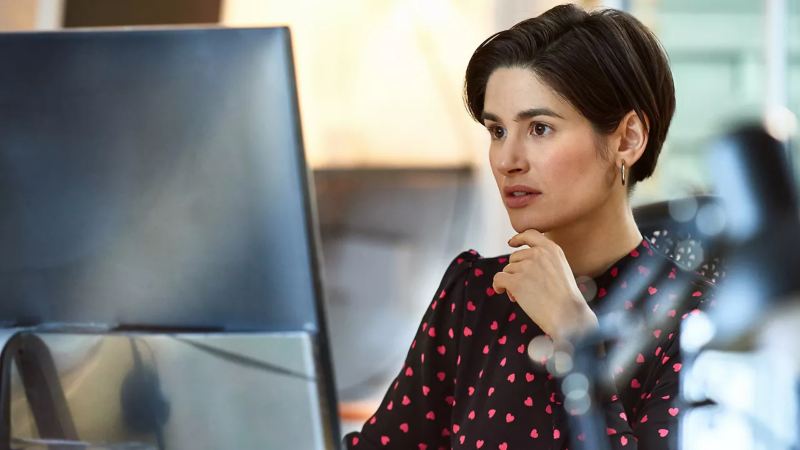 Woman working and staring at her computer screen