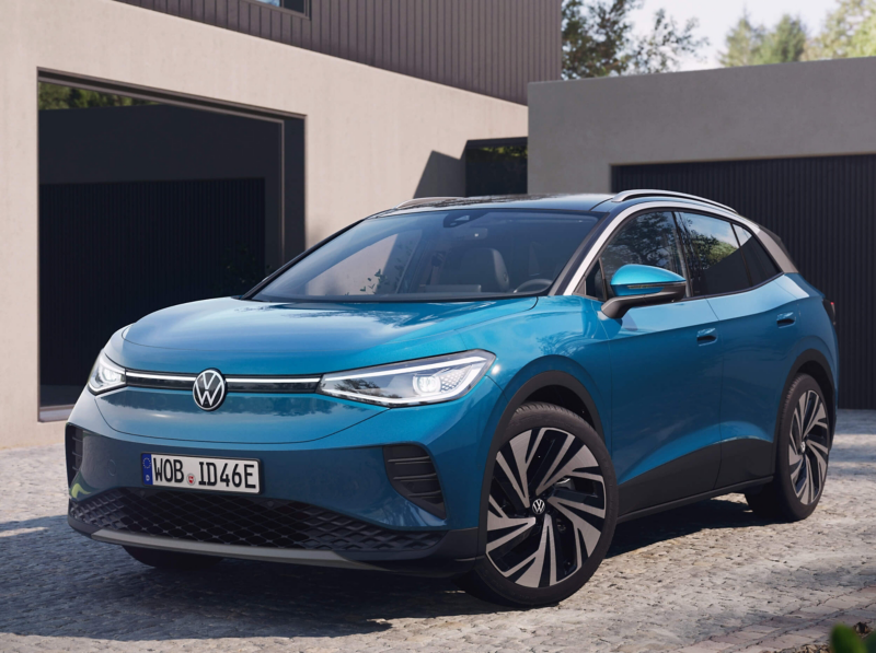 Exterior design of the Volkswagen ID. 4 parked next to a wall with a light display