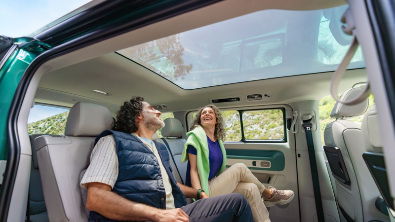 Passengers relaxing inside Volkswagen ID. Buzz cabin