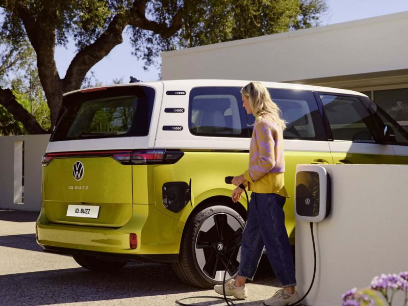 a yellow ID. Buzz being plugged into a home charger