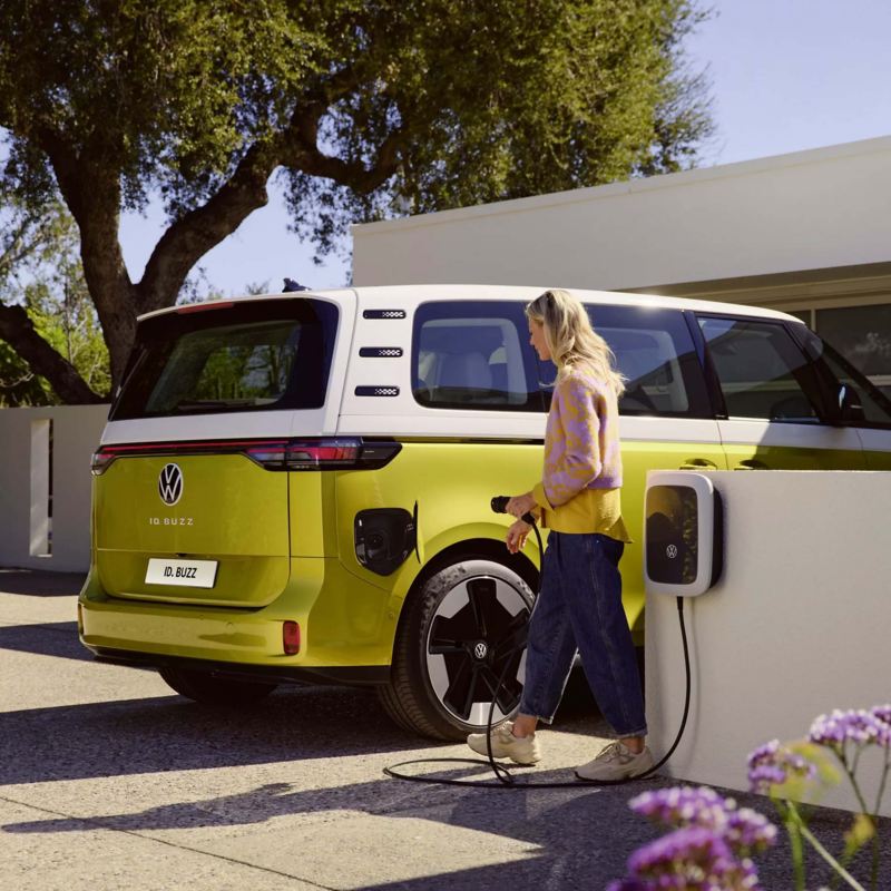 a yellow ID. Buzz being plugged into a home charger