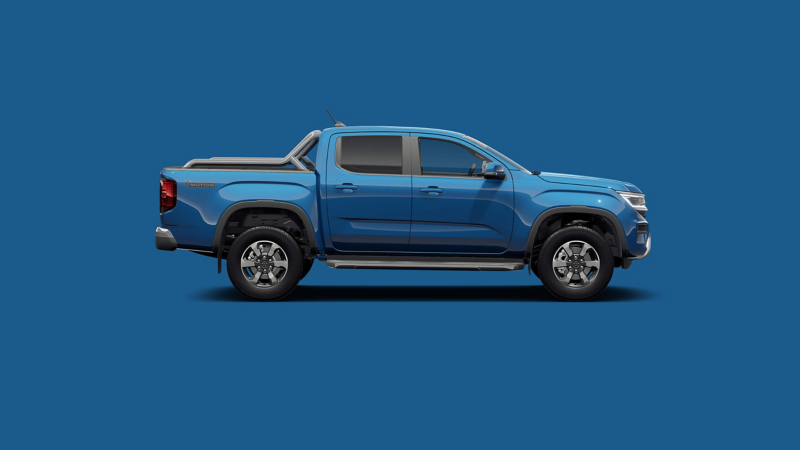 A VW Amarok against a blue plain background. 