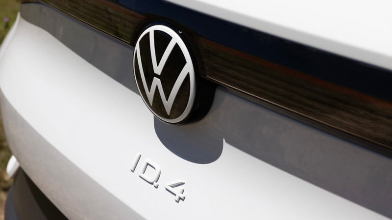a VW badge on the back of a white ID.4 