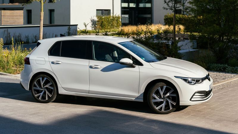 A side view of a white VW Golf