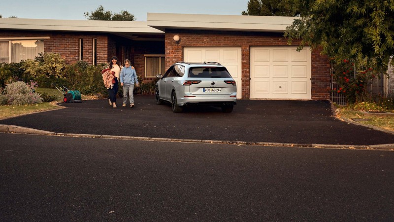 A VW Golf parked in front of a property