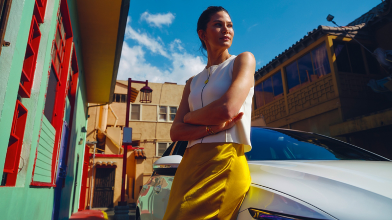 Person standing next to a white Golf GTE