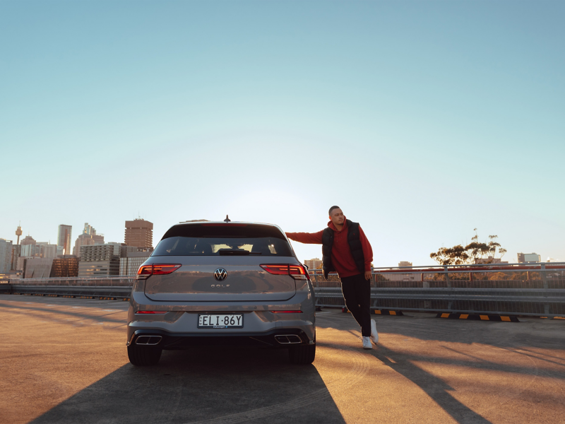 Rear side of the Model with the Volkswagen Golf R parked on the roof.