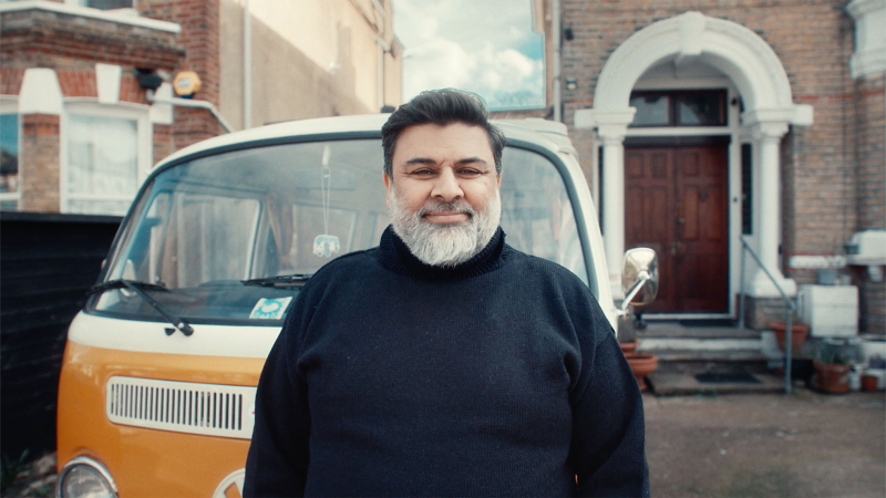 Photo showing Erum from the YourWagen promotion stood in front of a classic VW van.