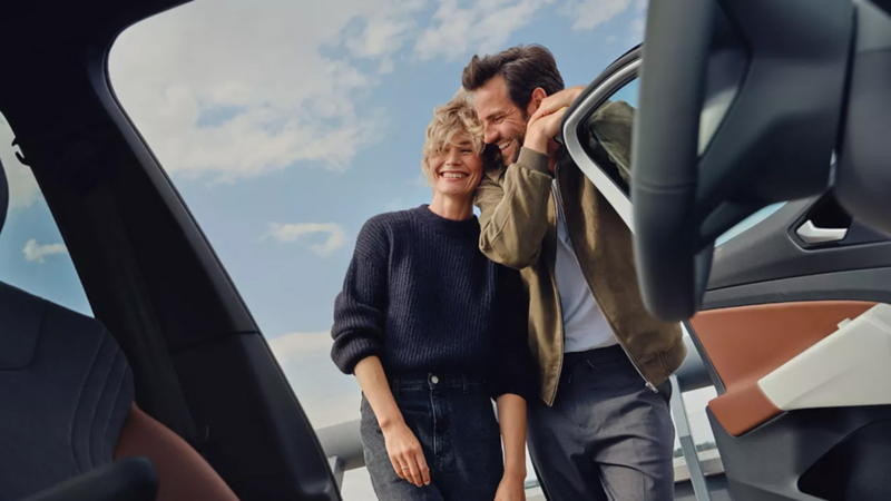 couple standing outside the car about to get in