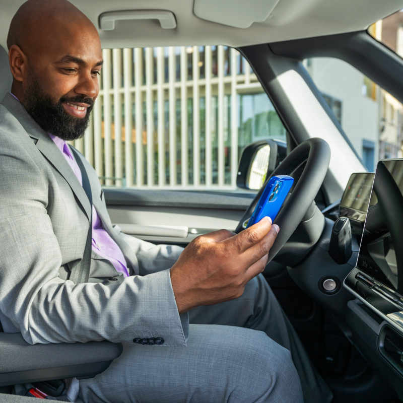 A man using a smart phone inside ID. Buzz
