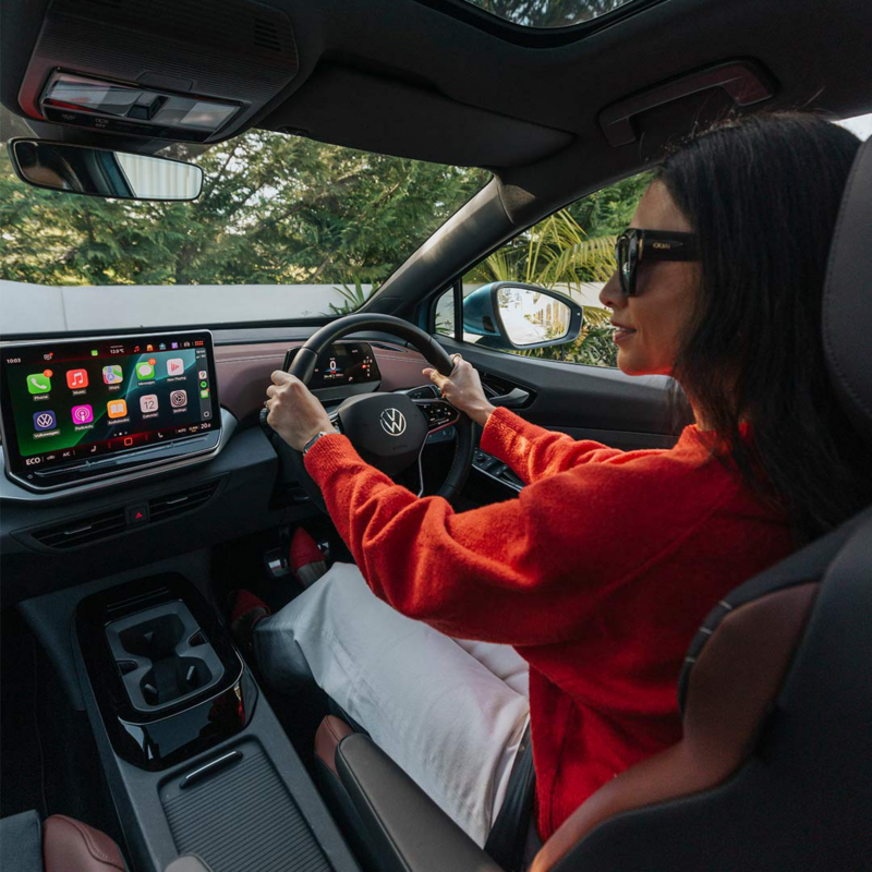 Close up shot of persons hands on steering wheel