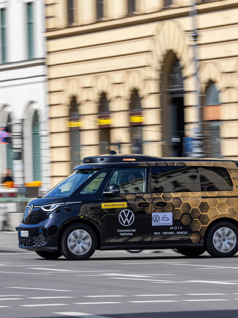 An autonomous driving VW vans in a city