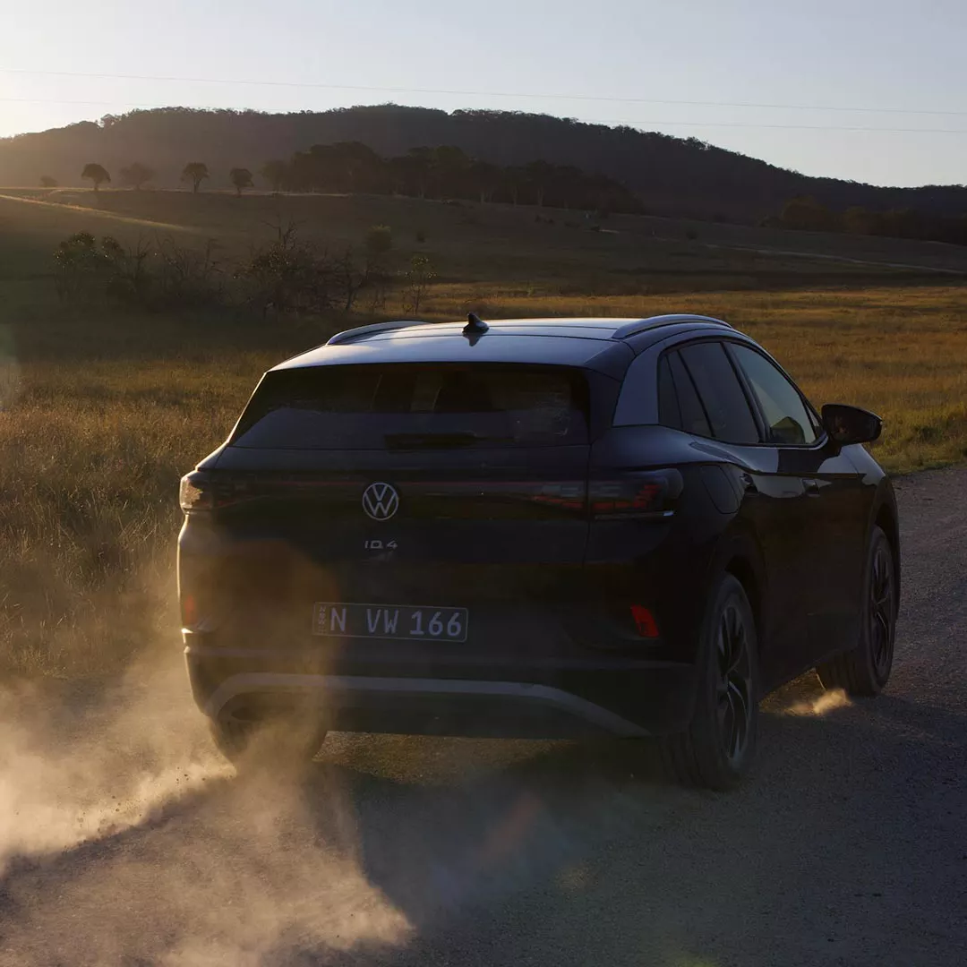 ID car driving off at sunset