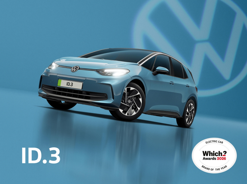 A front three-quarter view of a teal ID.3 set on a teal background with a transparent Volkswagen logo and a charging cable plugged into the charging port
