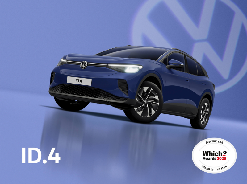 A front three-quarter view of a blue ID.4 set on a blue background with a transparent Volkswagen logo and a charging cable plugged into the charging port