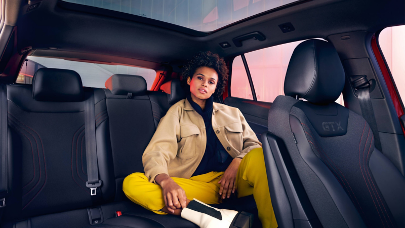 A woman sat in the back seats of an ID.4 GTX