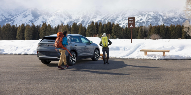 Hikers at trail head with VW ID.4.