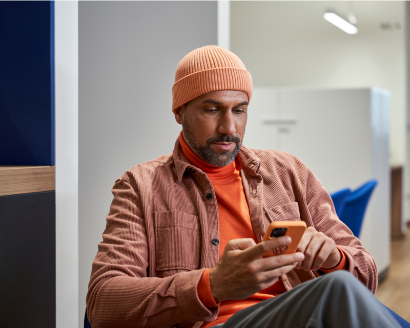 Man viewing quick start guide pdf on his mobile device.