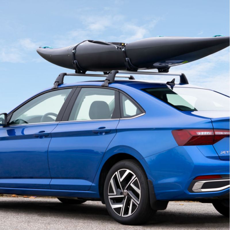 Blue VW Jetta with kayak.