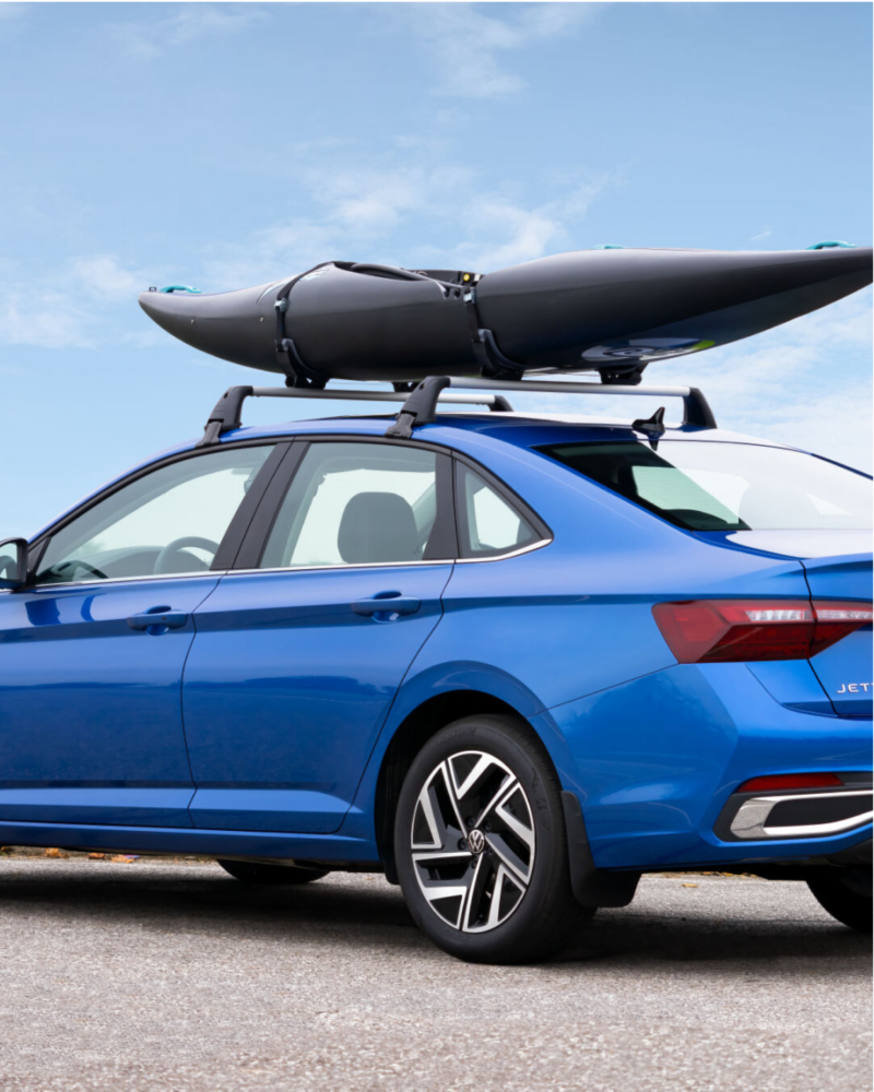 Blue VW Jetta with kayak.