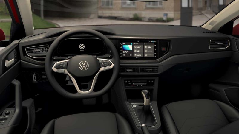 Volante multifunciones y panel central de control de Volkswagen Polo 2024. 
