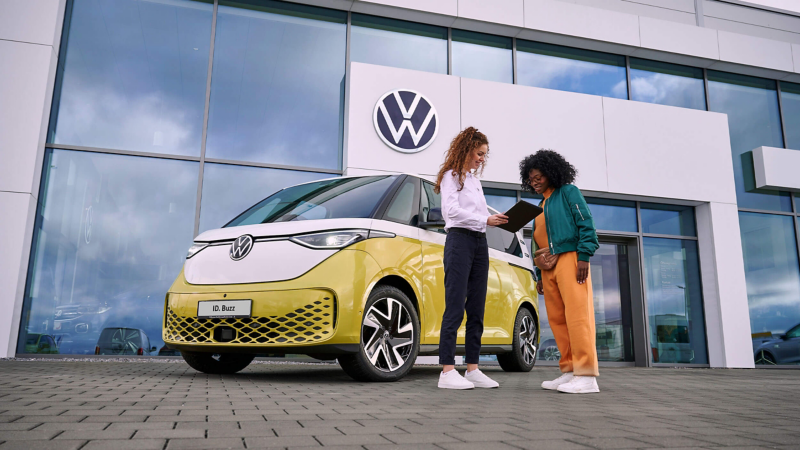 An ID. Buzz parked outside a VW Van Centre.